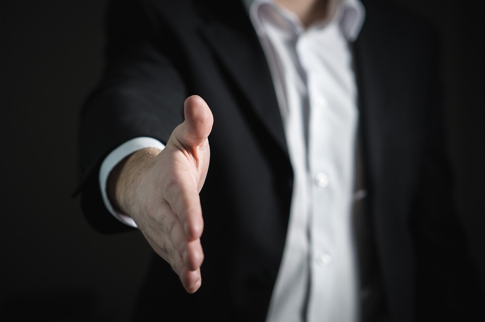 Man holding out his hand for handshake